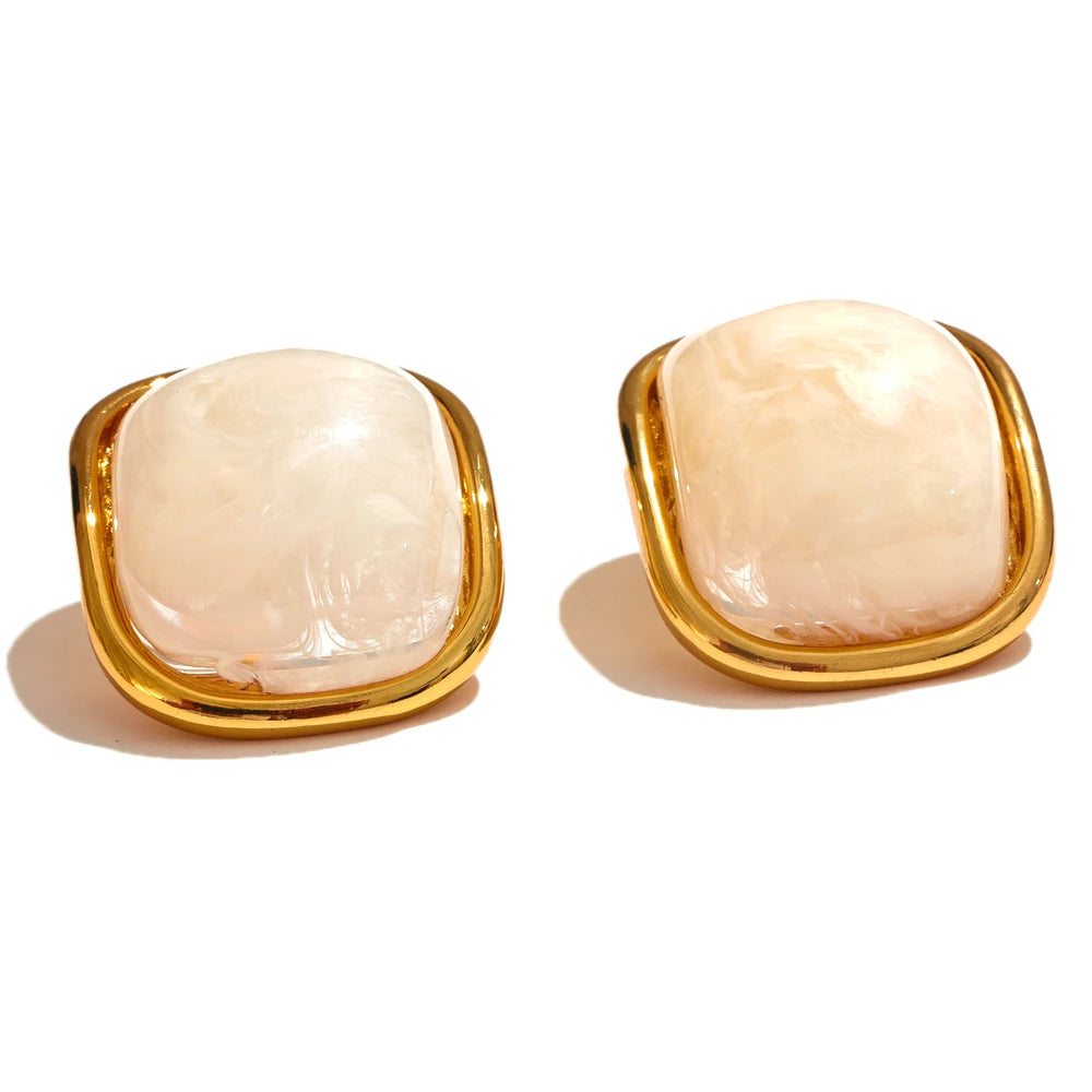 Stainless steel marble orange resin stud earrings. Waterproof and tarnish free.
