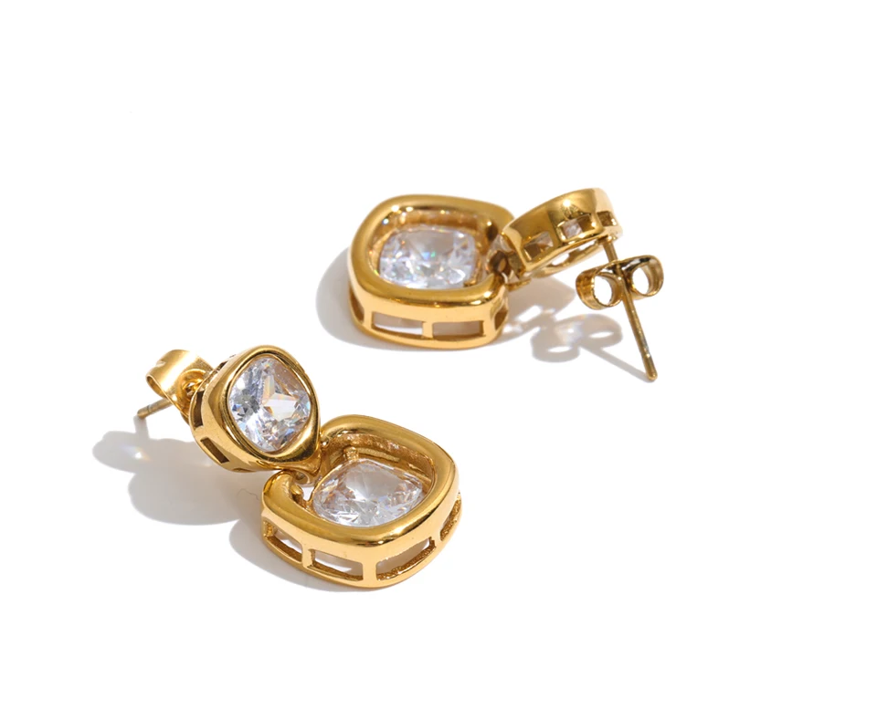 Shop the Sophie Earrings: modern drop studs with stacked cushion-cut zircons. Waterproof, hypoallergenic stainless steel in 18k gold-tone.