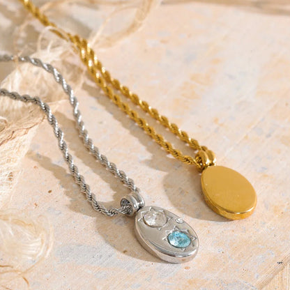 The Alba Necklace: aqua zircon, starburst details, twisted rope chain. Silver or gold. Tarnish-free, everyday.