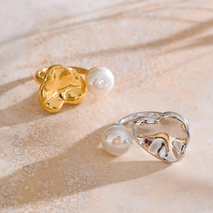 Two rings with pearls on a textured surface -stainles steel adjustable