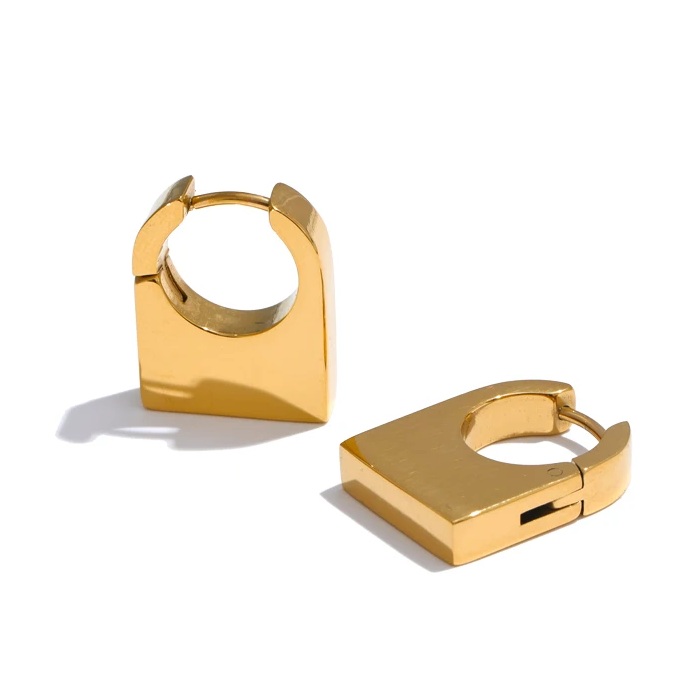 Gold hoop earrings on a white background