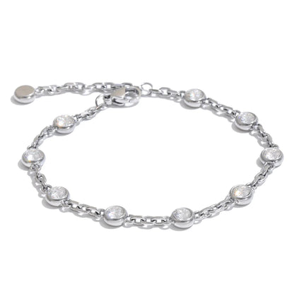 April Bracelet – dainty cable chain with bezel-set zircons. Tarnish-free stainless steel, silver or gold-tone. Adjustable, everyday sparkle.