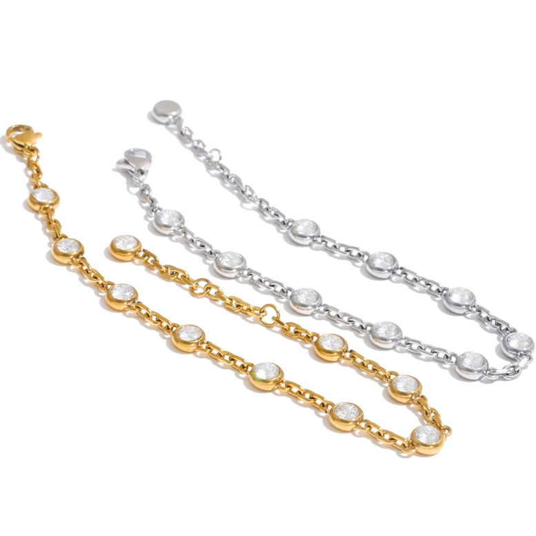 April Bracelet – dainty cable chain with bezel-set zircons. Tarnish-free stainless steel, silver or gold-tone. Adjustable, everyday sparkle.