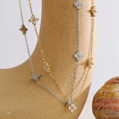 Star-shaped necklaces on a mannequin with a neutral background