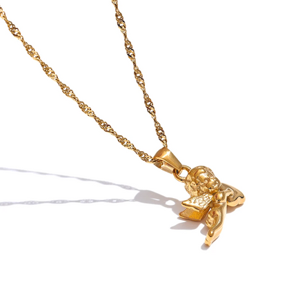 Gold necklace with a detailed pendant on a white background