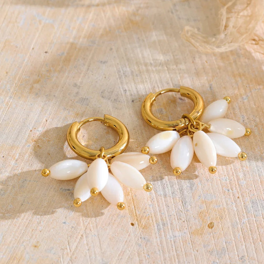 Dakota Earrings – gold huggie hoops with a fan of pearlescent petal charms. Tarnish-free stainless steel, 18k gold-tone. Lightweight and floral.