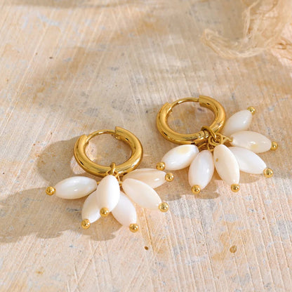 Dakota Earrings – gold huggie hoops with a fan of pearlescent petal charms. Tarnish-free stainless steel, 18k gold-tone. Lightweight and floral.