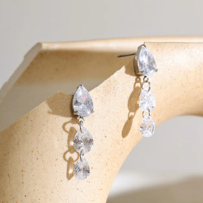 Frankie Earrings – cascading pear, round & marquise zircon drops. Tarnish-free stainless steel, silver or gold-tone. Everyday sparkle.