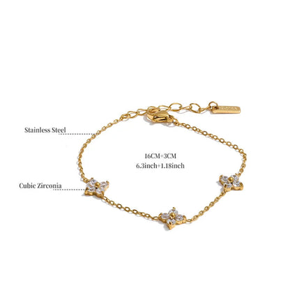 Gold bracelet with cubic zirconia stones on a white background
