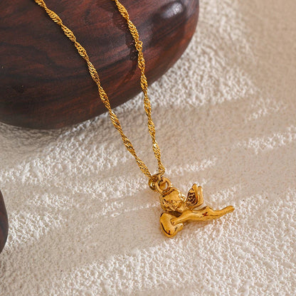 Gold necklace with a pendant on a textured surface
