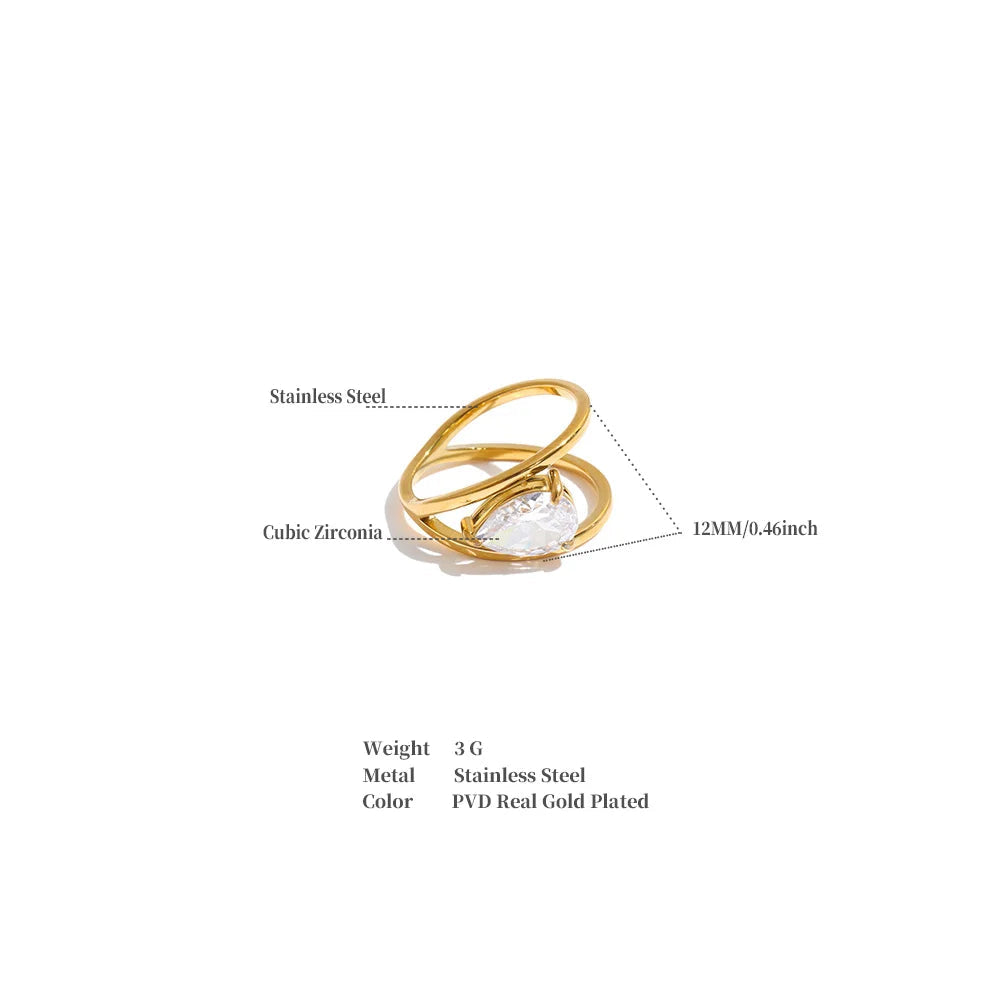 A gold-plated stainless steel ring with a cubic zirconia accent, shown on a white background with text labels indicating material, color, and dimensions, plus a weight specification of 3g.