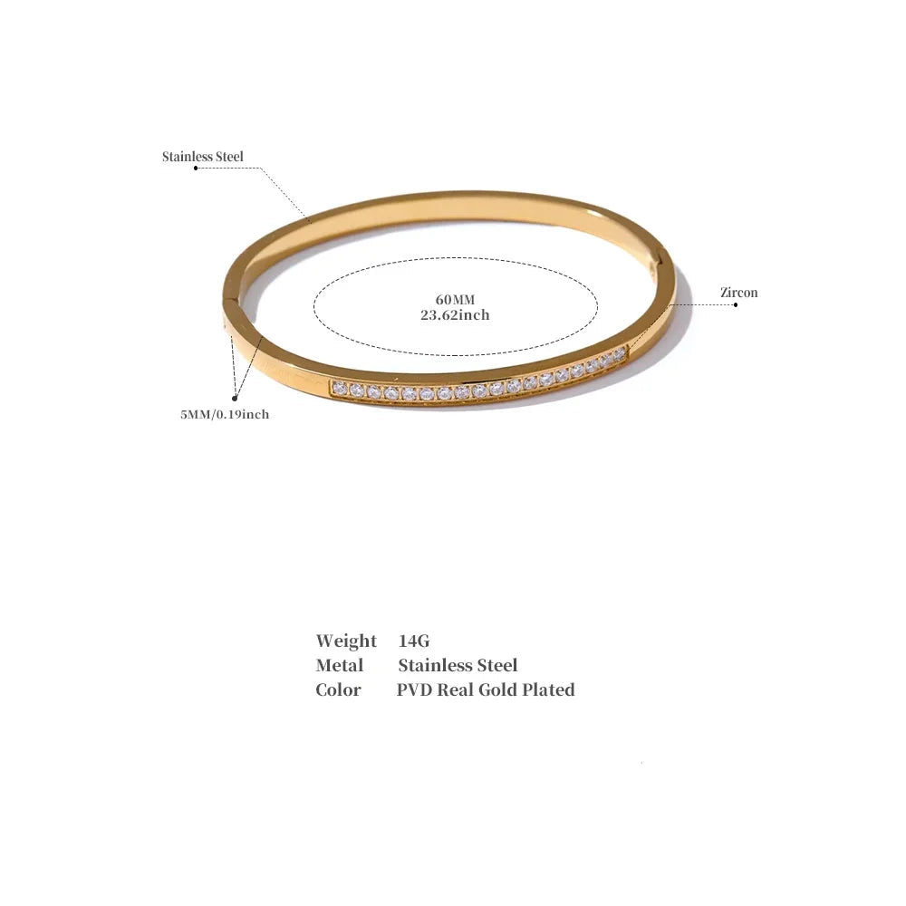 Gold bracelet with measurement details on a white background