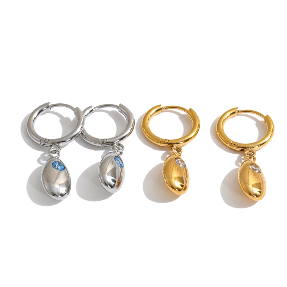 Shop the Helena Earrings: hinged huggies with a smooth oval drop and zircon accent. Waterproof stainless steel, silver or 18k gold.