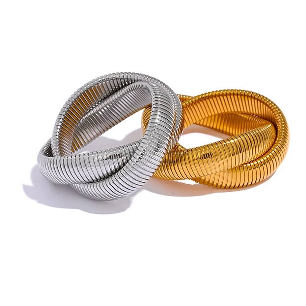 two metallic bracelets in gold and silver on a white background with text about fashion and personality.
