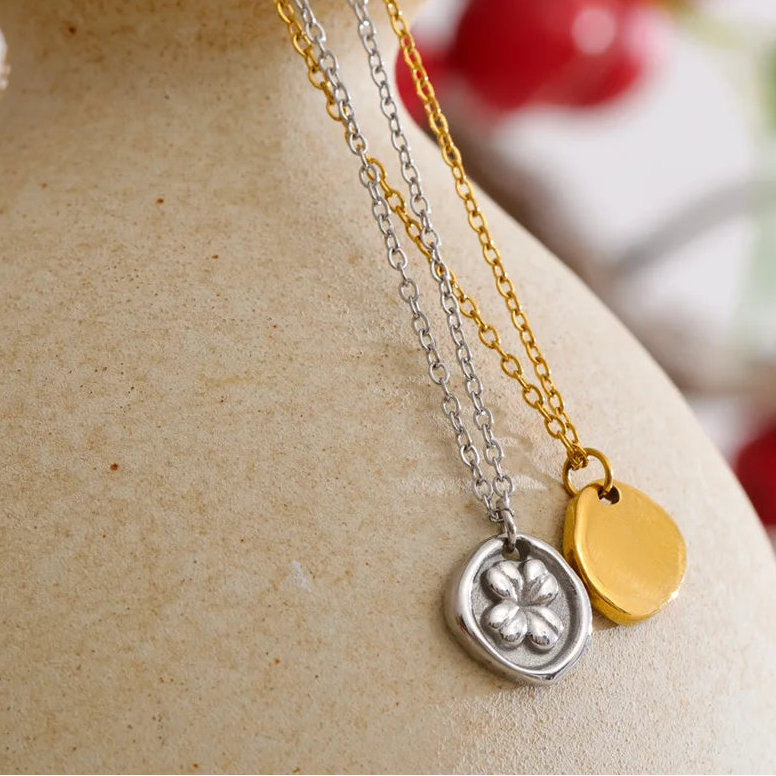 Two necklaces, one silver and one gold, Stainless steel
