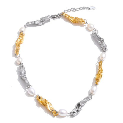 Shop the Julia Necklace: organic molten-link design with faux pearls. Available in gold, silver, or mixed metal finishes. Stainless Steel