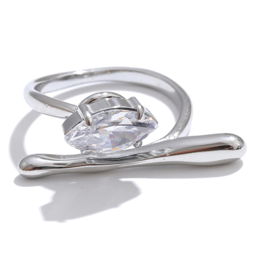 Silver stainless steel ring with a clear gemstone on a white background