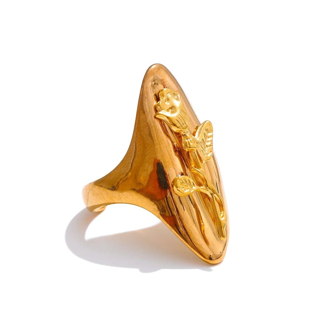 Gold stainless steel ring with angel design on a white background