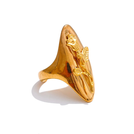 Gold ring with a unique design on a white background
