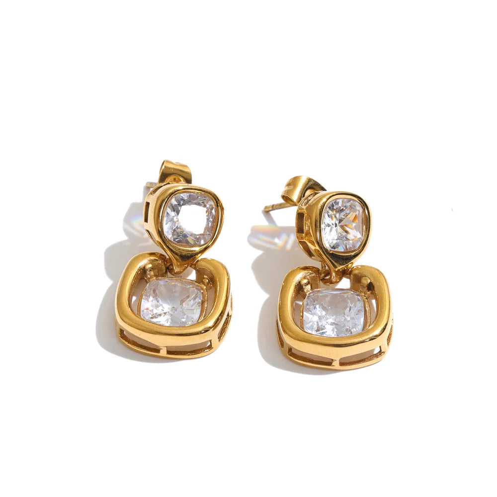 Shop the Sophie Earrings: modern drop studs with stacked cushion-cut zircons. Waterproof, hypoallergenic stainless steel in 18k gold-tone.