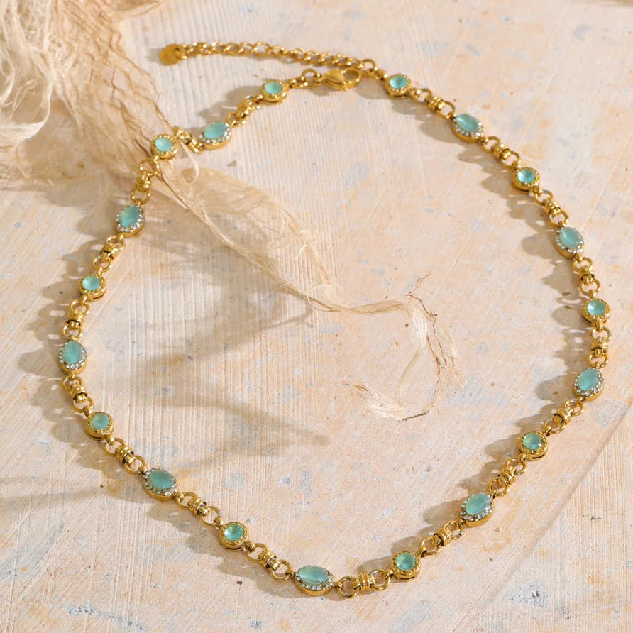 Vintage-inspired Vivienne Necklace: gold link chain with aqua-green stones and zircon halos. Tarnish-free stainless steel, adjustable fit.