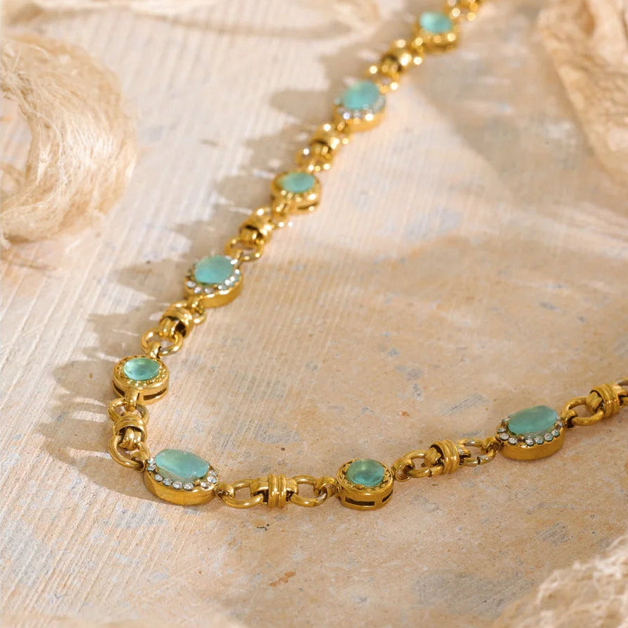 Vintage-inspired Vivienne Necklace: gold link chain with aqua-green stones and zircon halos. Tarnish-free stainless steel, adjustable fit.