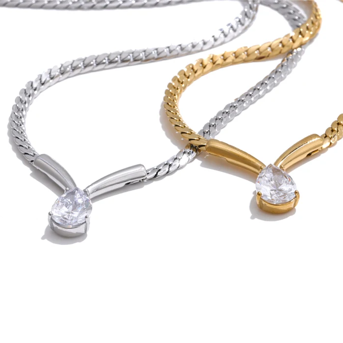 Whitney Necklace – sleek herringbone chain with a pear zircon pendant. Tarnish-free stainless steel, silver or gold. Adjustable fit.