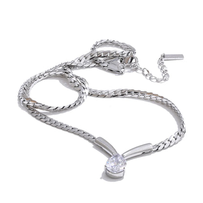 Whitney Necklace – sleek herringbone chain with a pear zircon pendant. Tarnish-free stainless steel, silver or gold. Adjustable fit.