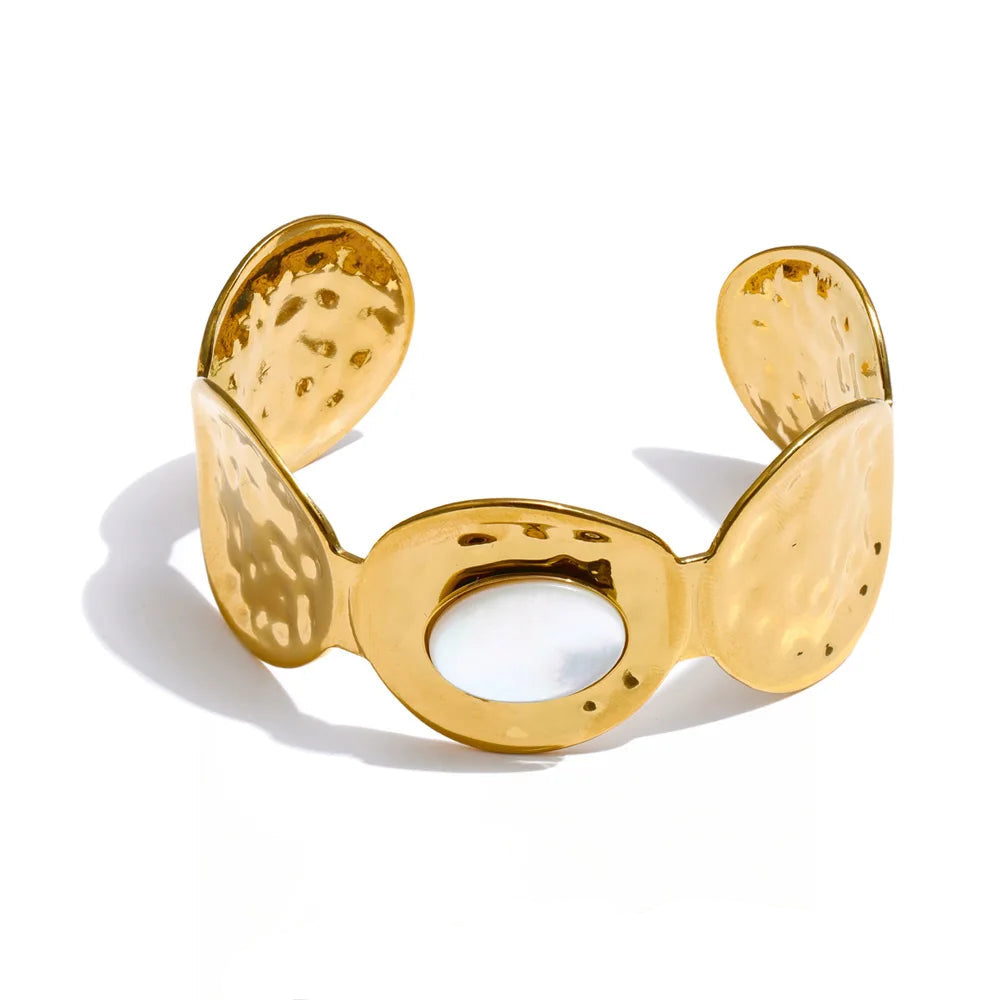 Gold bracelet with a textured design on a white background, stainless steel.