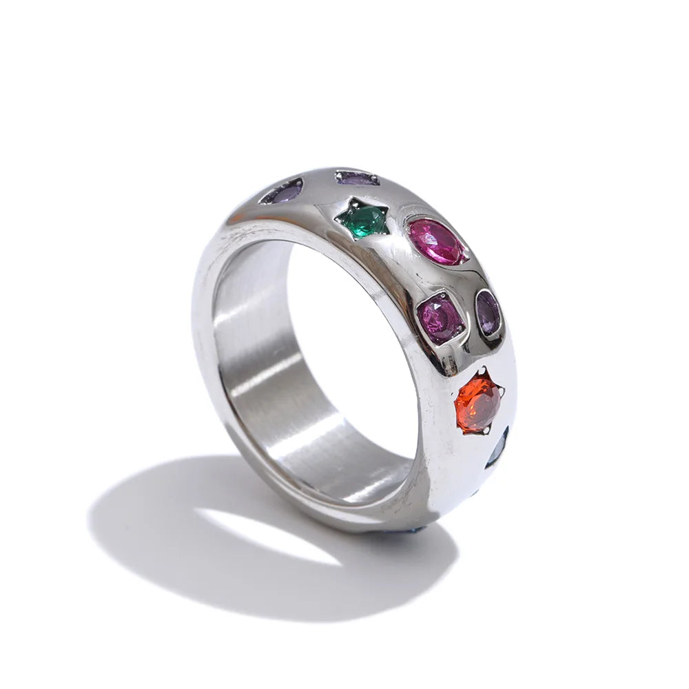 Silver ring with colorful gemstones on a white background