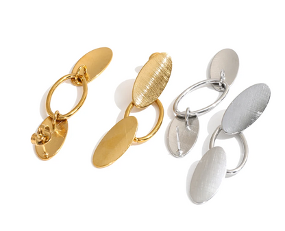 Shop the Emily Earrings: minimalist brushed-finish oval drops in silver or 18k gold-tone. Waterproof, hypoallergenic stainless steel.