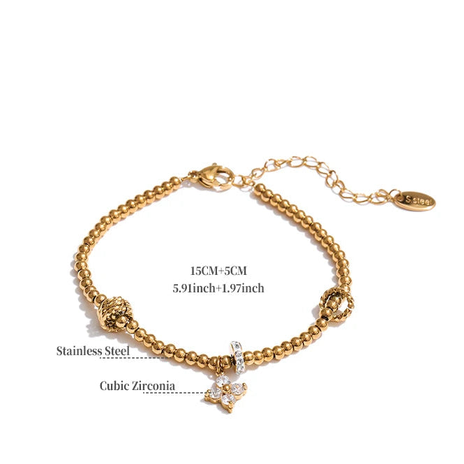 Gold stainless steel charm bracelet.