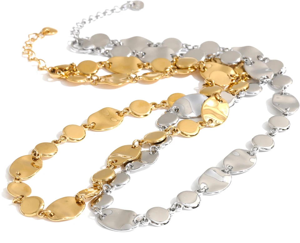 Shop the Jessica Necklace: bold organic disc necklace with a wavy, light-catching finish. Waterproof stainless steel, adjustable fit.