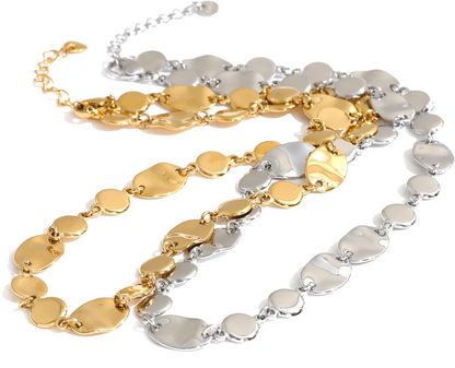 Shop the Jessica Necklace: bold organic disc necklace with a wavy, light-catching finish. Waterproof stainless steel, adjustable fit.