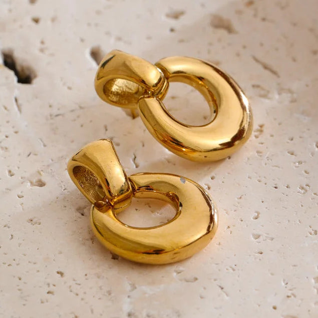 Two polished gold earrings stainless steel