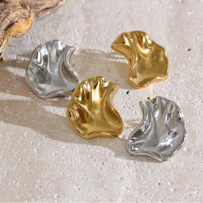 Four abstract, organic-shaped earrings in polished gold and silver finishes, stainless steel, waterproof.