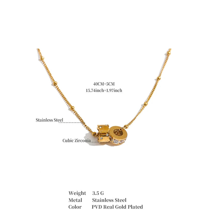 Gold-plated stainless steel necklace with a cubic zirconia pendant, shown on a white background with text detailing its dimensions, weight, and material.