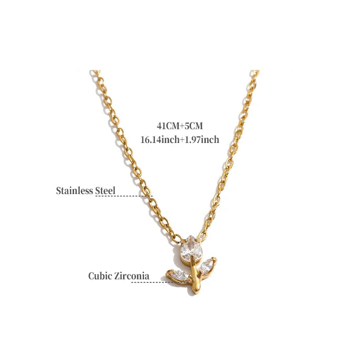 Gold-plated stainless steel anchor pendant necklace with a clear crystal accent, shown on a white background with text indicating dimensions, weight, and material details.