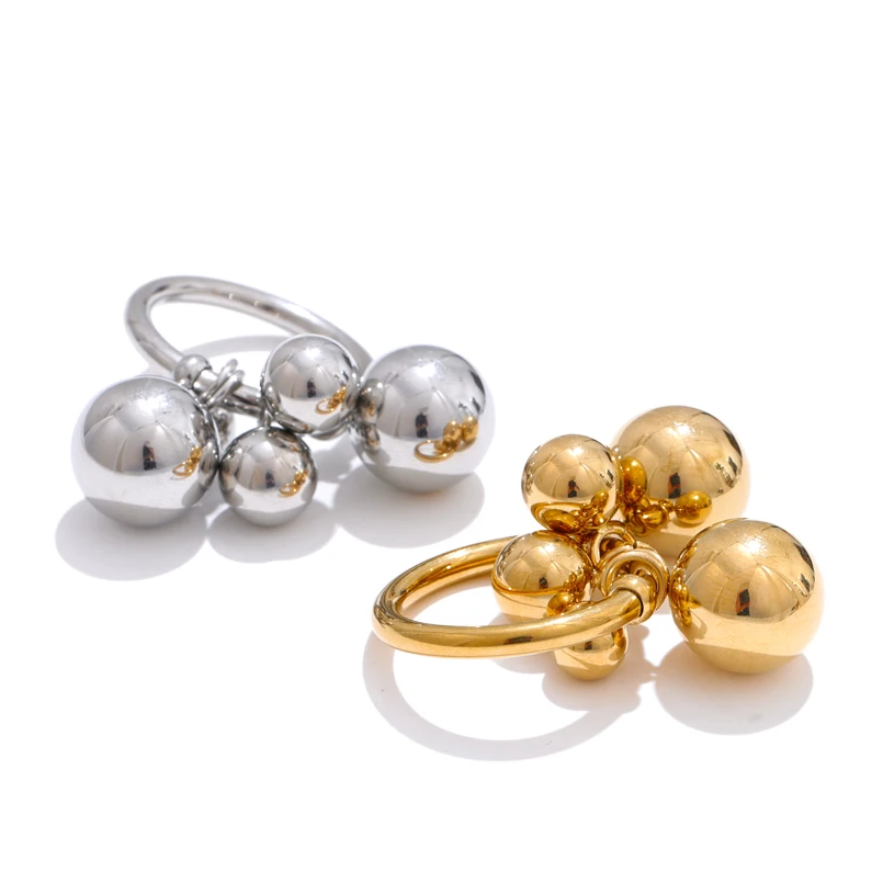 Gold and silver earrings on a white background