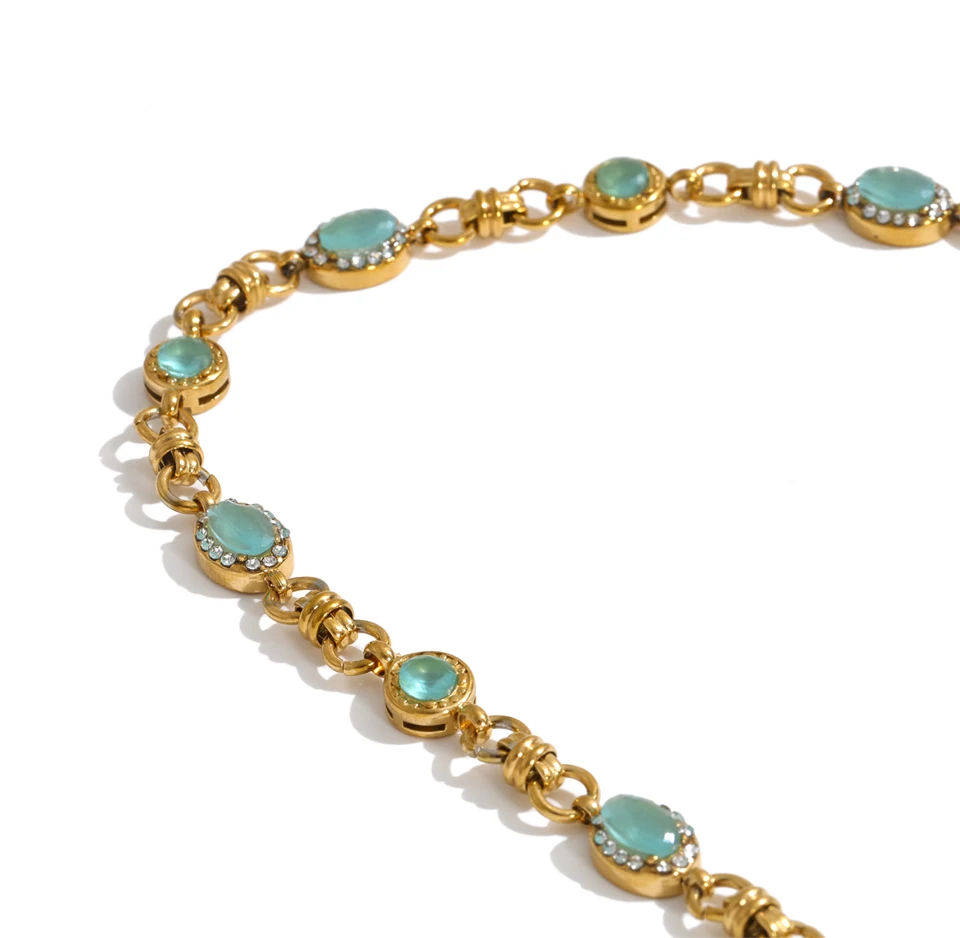 Vintage-inspired Vivienne Necklace: gold link chain with aqua-green stones and zircon halos. Tarnish-free stainless steel, adjustable fit.