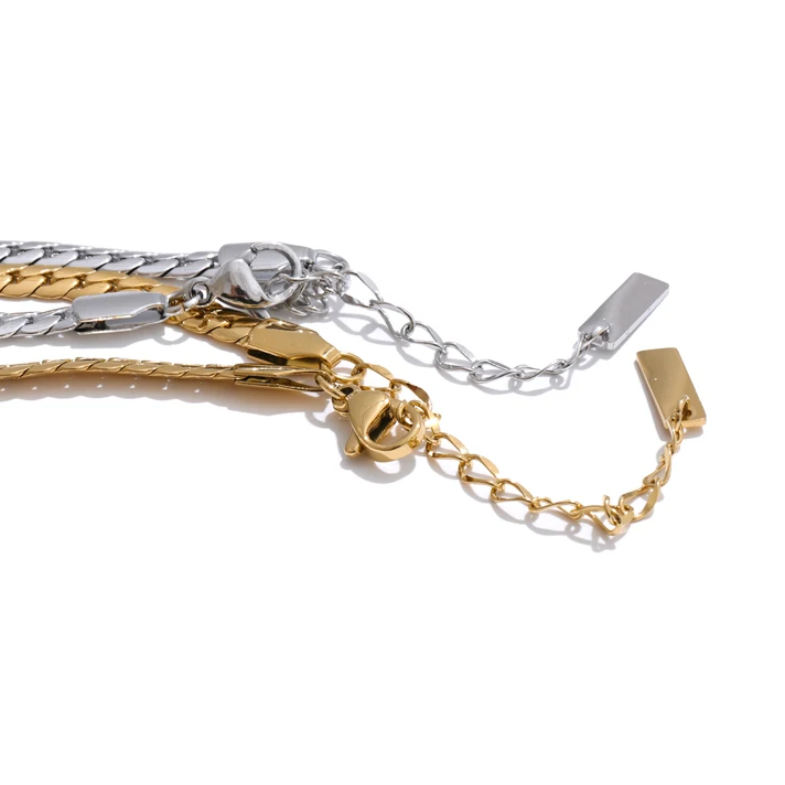Whitney Necklace – sleek herringbone chain with a pear zircon pendant. Tarnish-free stainless steel, silver or gold. Adjustable fit.