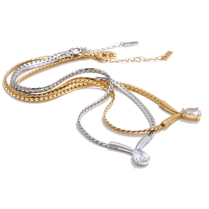 Whitney Necklace – sleek herringbone chain with a pear zircon pendant. Tarnish-free stainless steel, silver or gold. Adjustable fit.